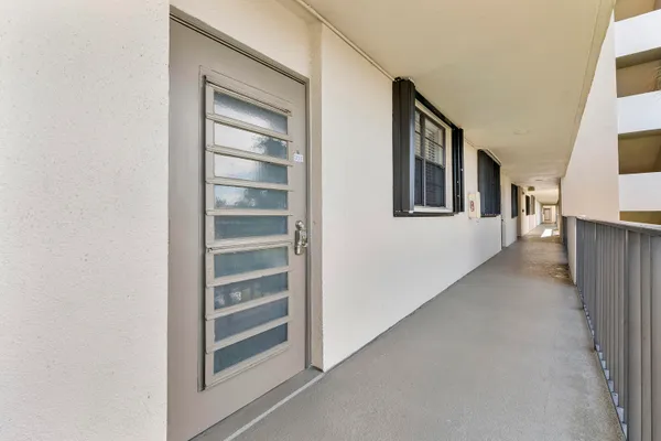 a view of an empty room with a staircase