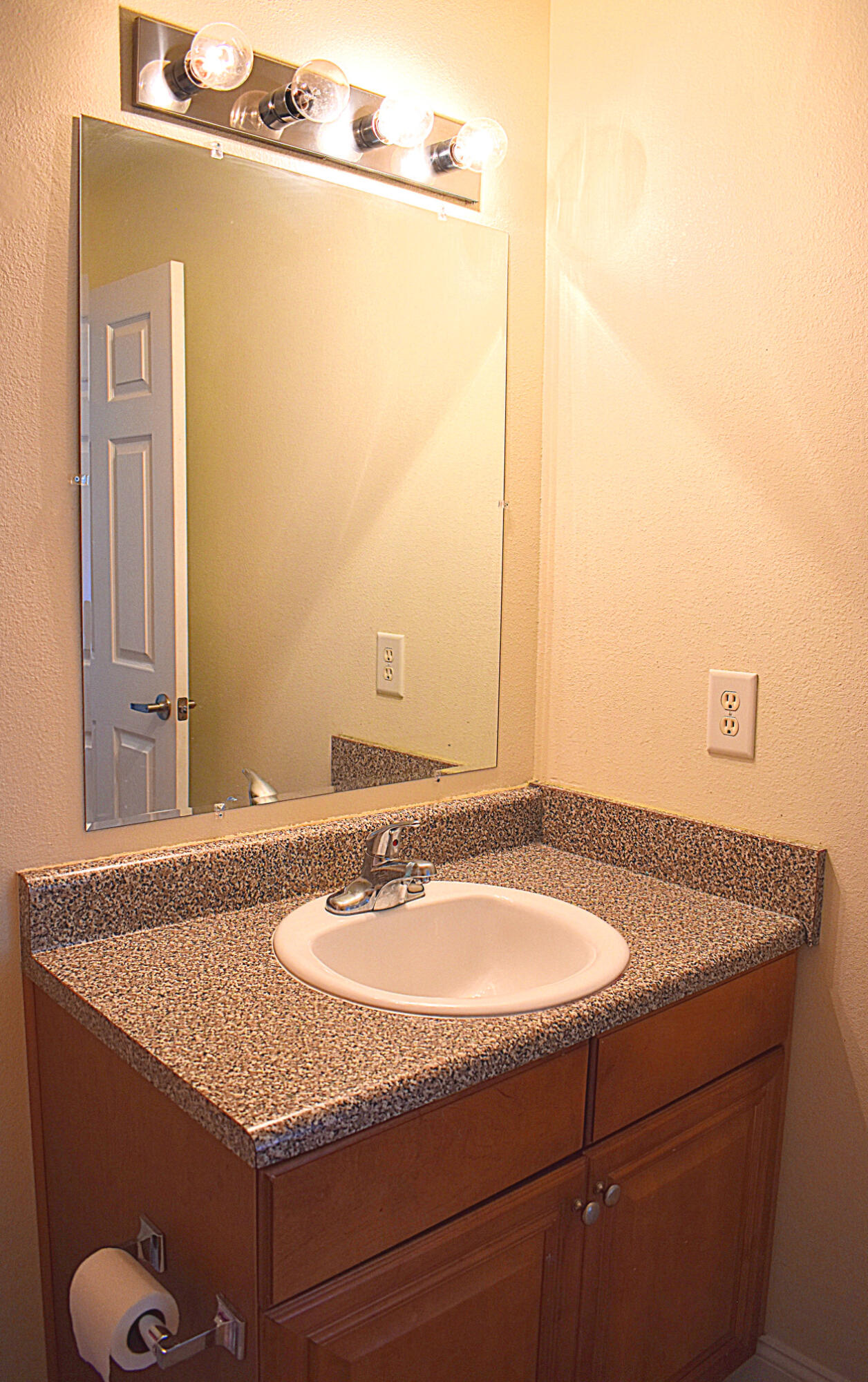 535 Wingspan Way Crestview, FL 32536 - Photo 15 of 20 a bathroom with a granite countertop sink and a mirror