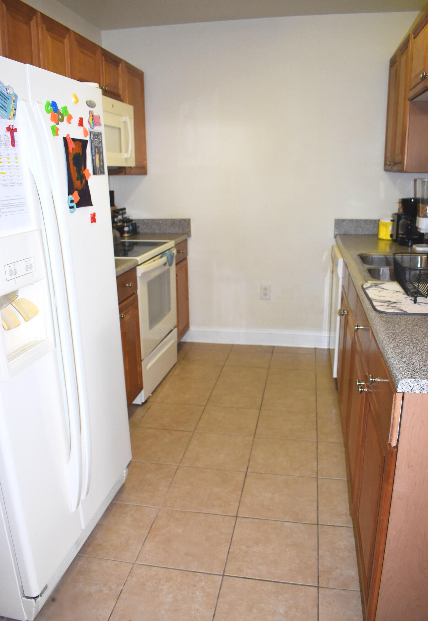 535 Wingspan Way Crestview, FL 32536 - Photo 6 of 20 a kitchen with a stove top oven and cabinets