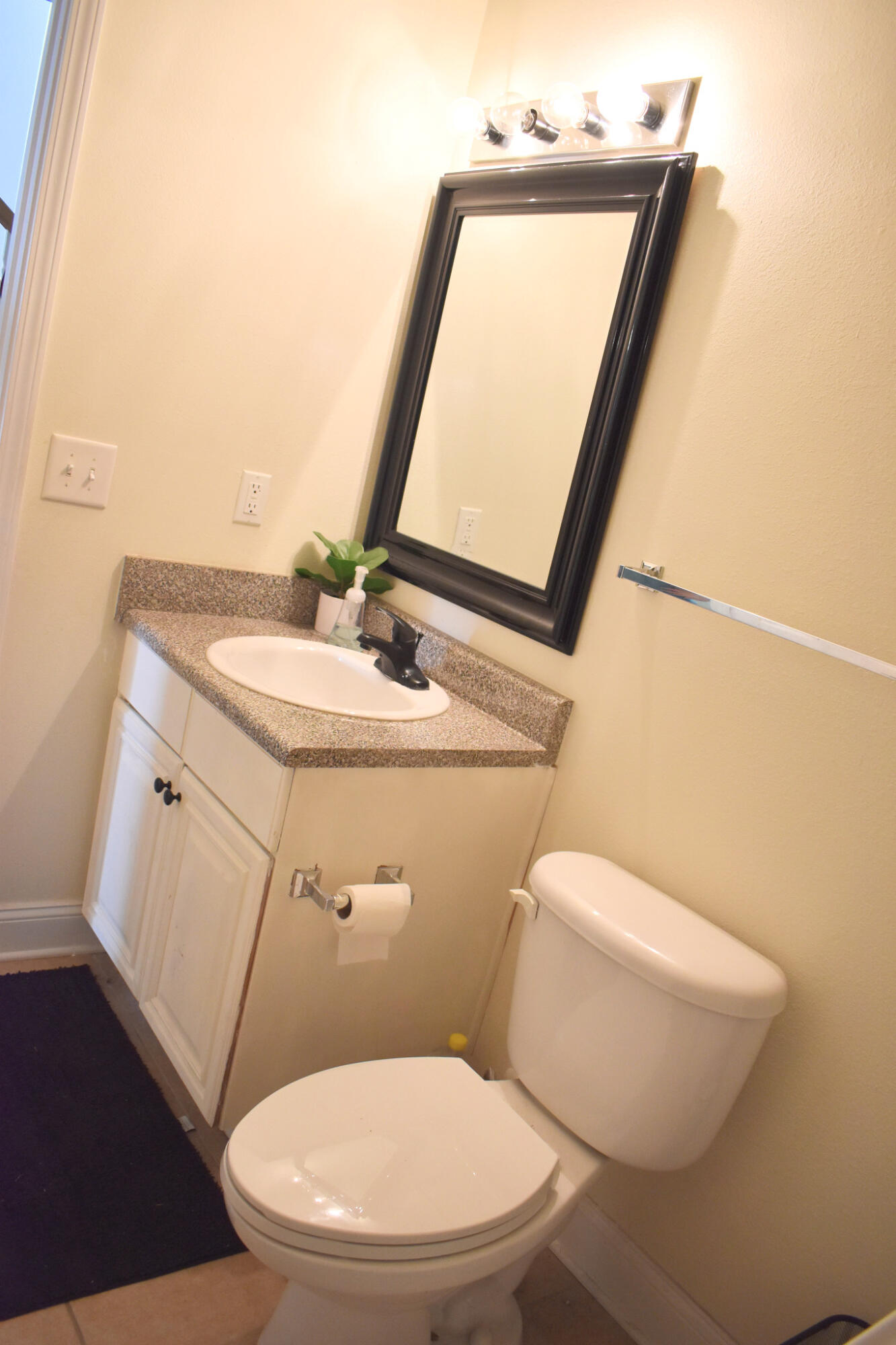 535 Wingspan Way Crestview, FL 32536 - Photo 7 of 20 a white toilet sitting next to a bathroom sink