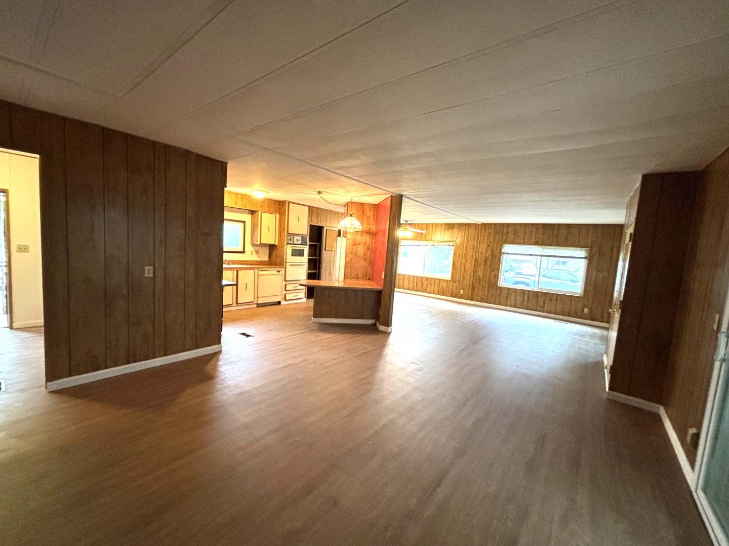 3156 Esplanade, Unit 304 Chico, CA 95973 - Photo 12 of 30 an empty room with wooden floor and windows