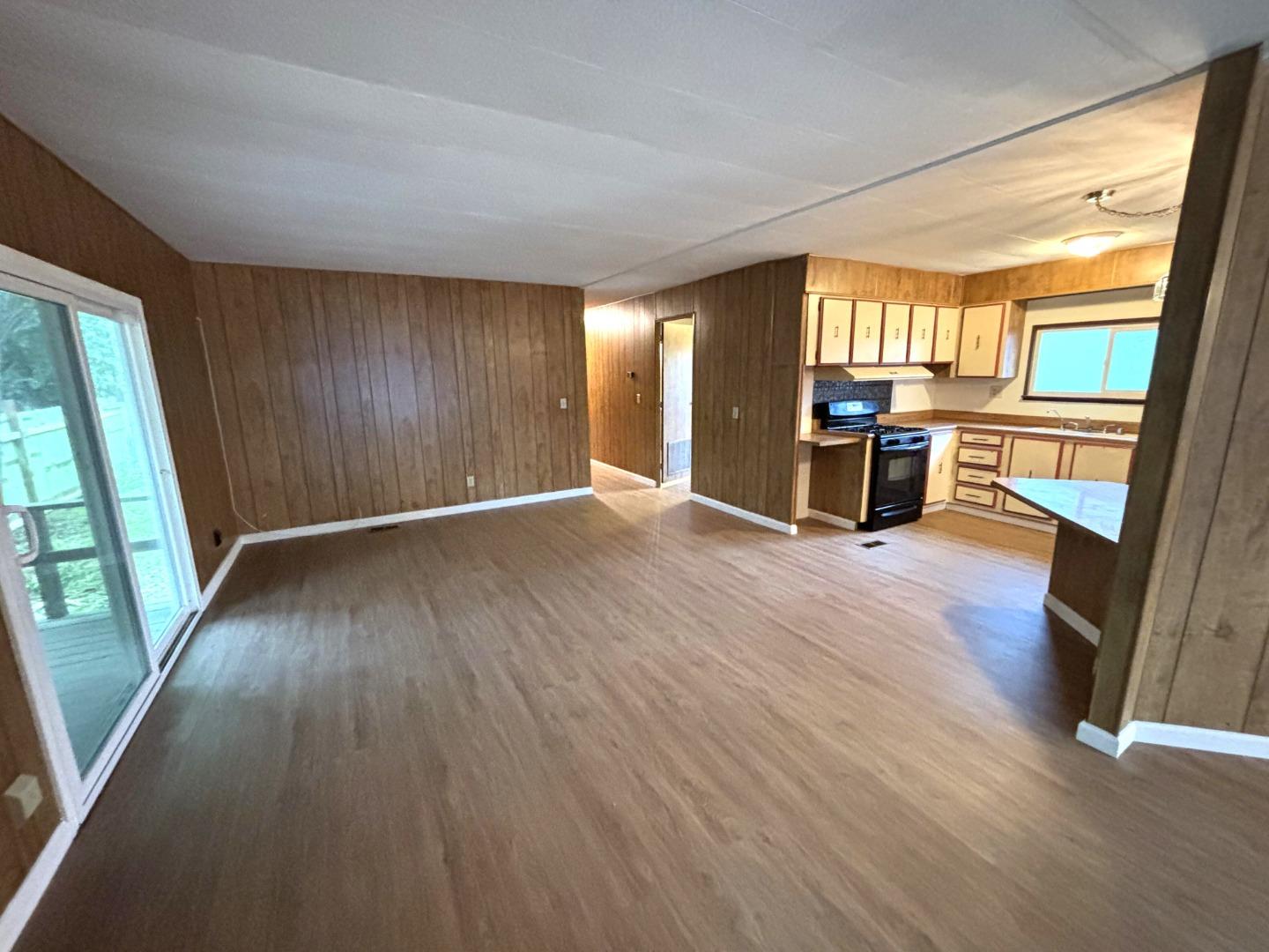 3156 Esplanade, Unit 304 Chico, CA 95973 - Photo 14 of 30 wooden floor in an empty room with a window