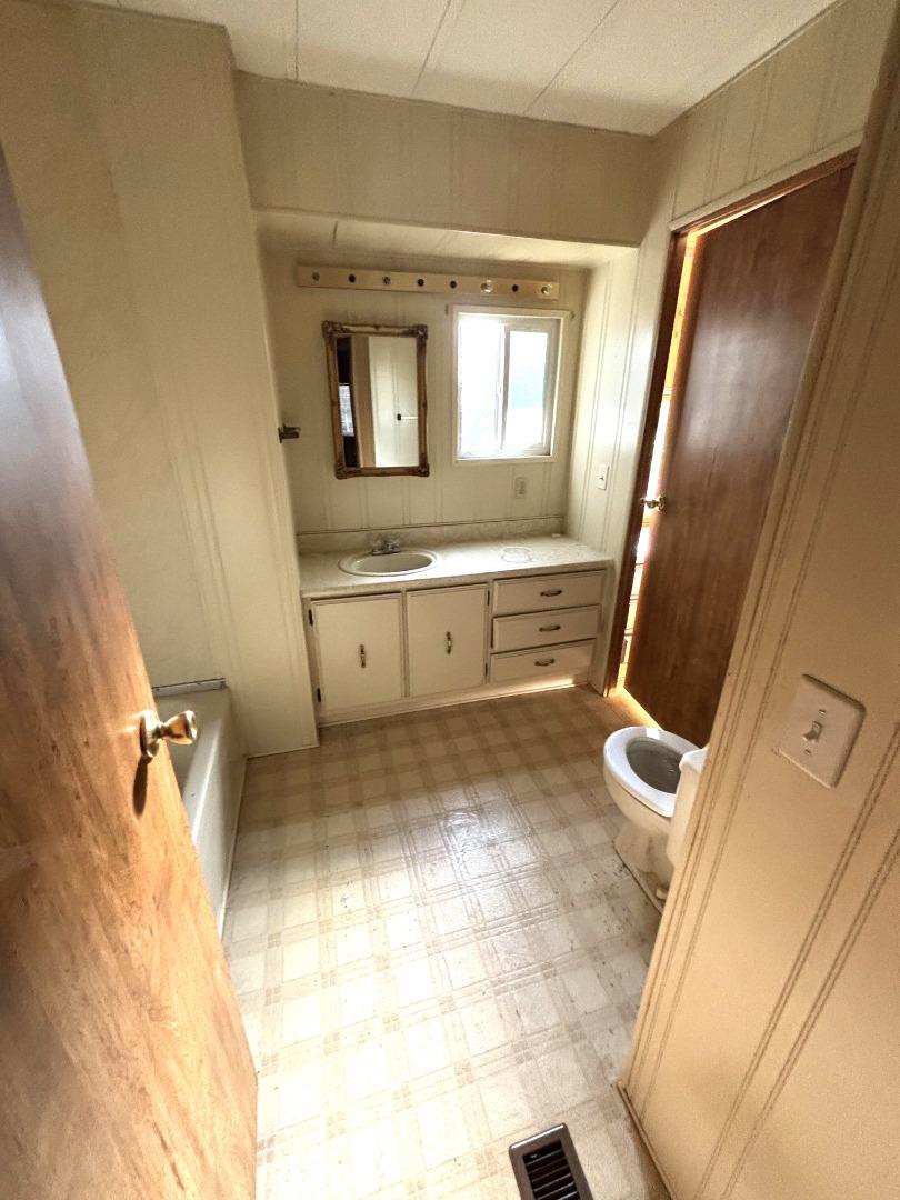 3156 Esplanade, Unit 304 Chico, CA 95973 - Photo 22 of 30 a bathroom with a sink a mirror and a bathtub