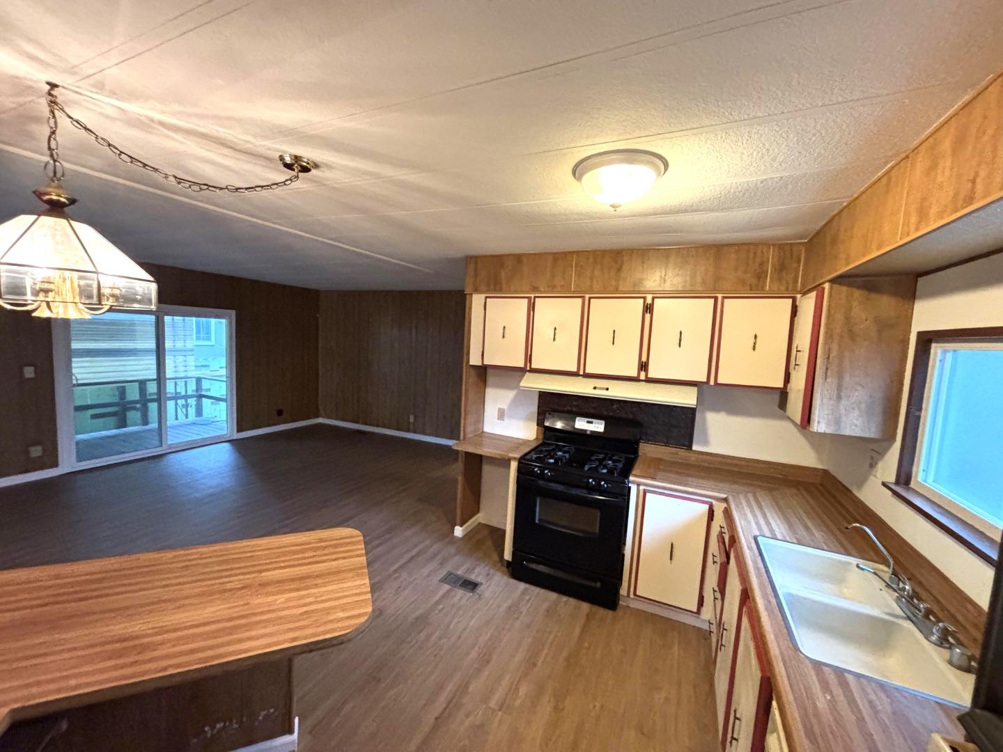 3156 Esplanade, Unit 304 Chico, CA 95973 - Photo 24 of 30 a view of kitchen with stove and wooden floor