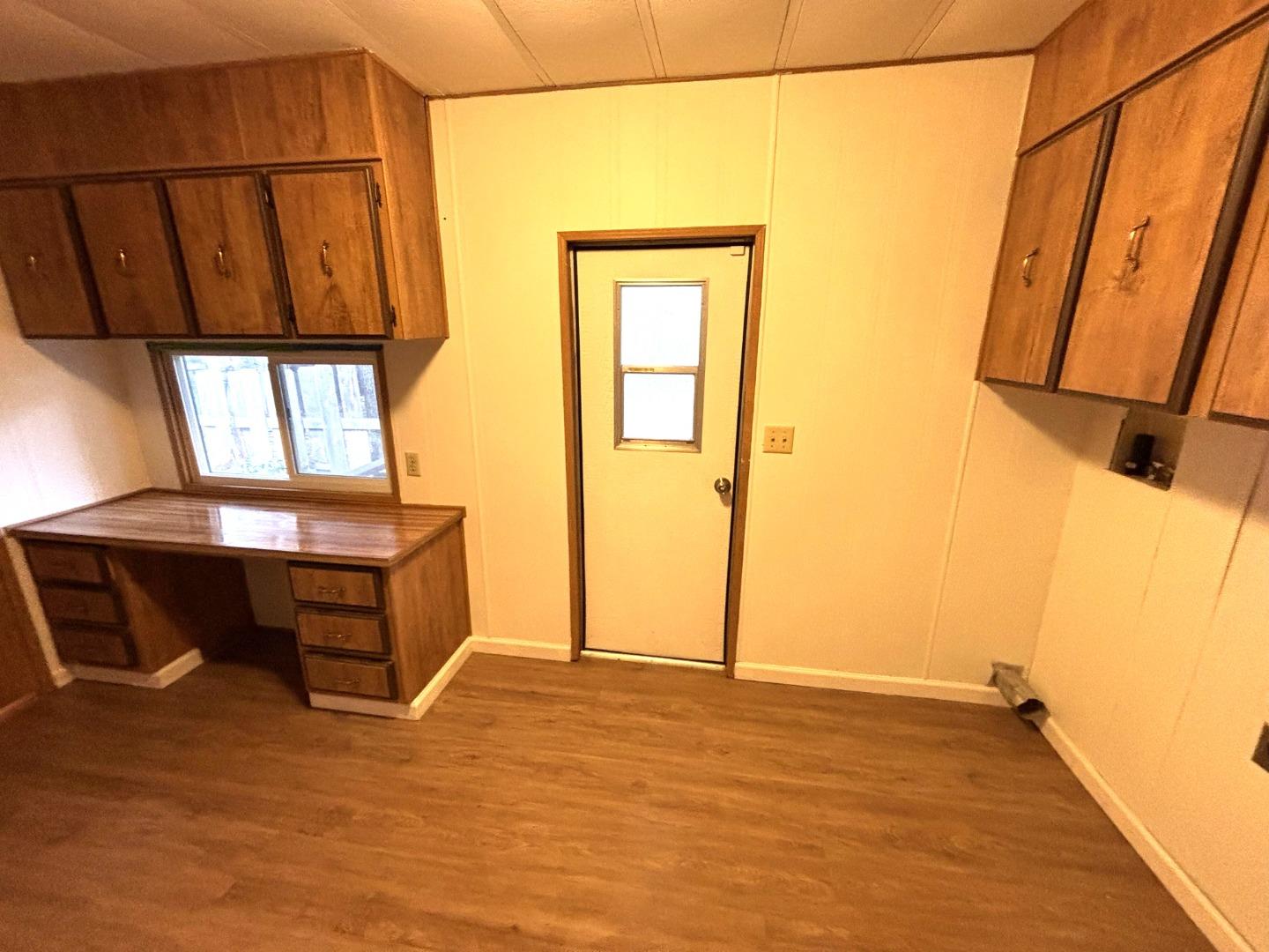 3156 Esplanade, Unit 304 Chico, CA 95973 - Photo 8 of 30 a view of a room with wooden floor and a window