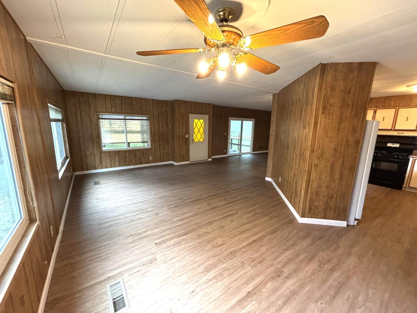 3156 Esplanade, Unit 304 Chico, CA 95973 - Photo 10 of 30 an empty room with wooden floor and windows