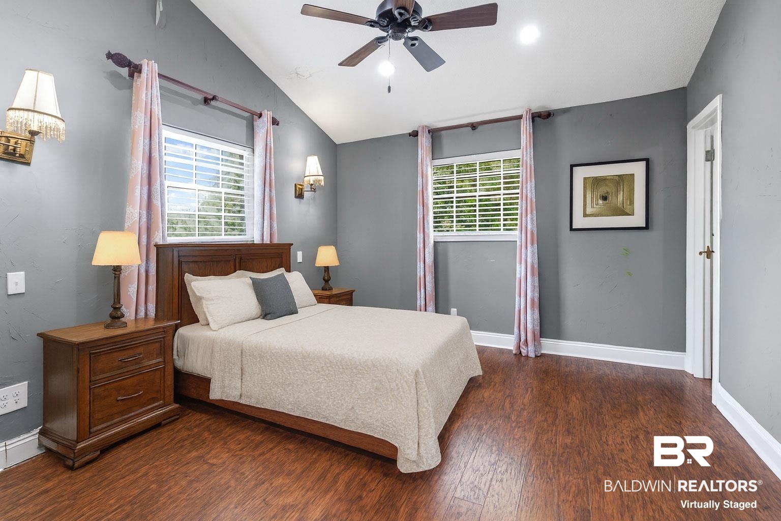 36 Ridgeview Drive Mobile, AL 36611 - Photo 9 of 20 Virtually staged primary bedroom featuring lofted ceiling, dark wood finished floors, a ceiling fan, multiple windows, and recessed lighting