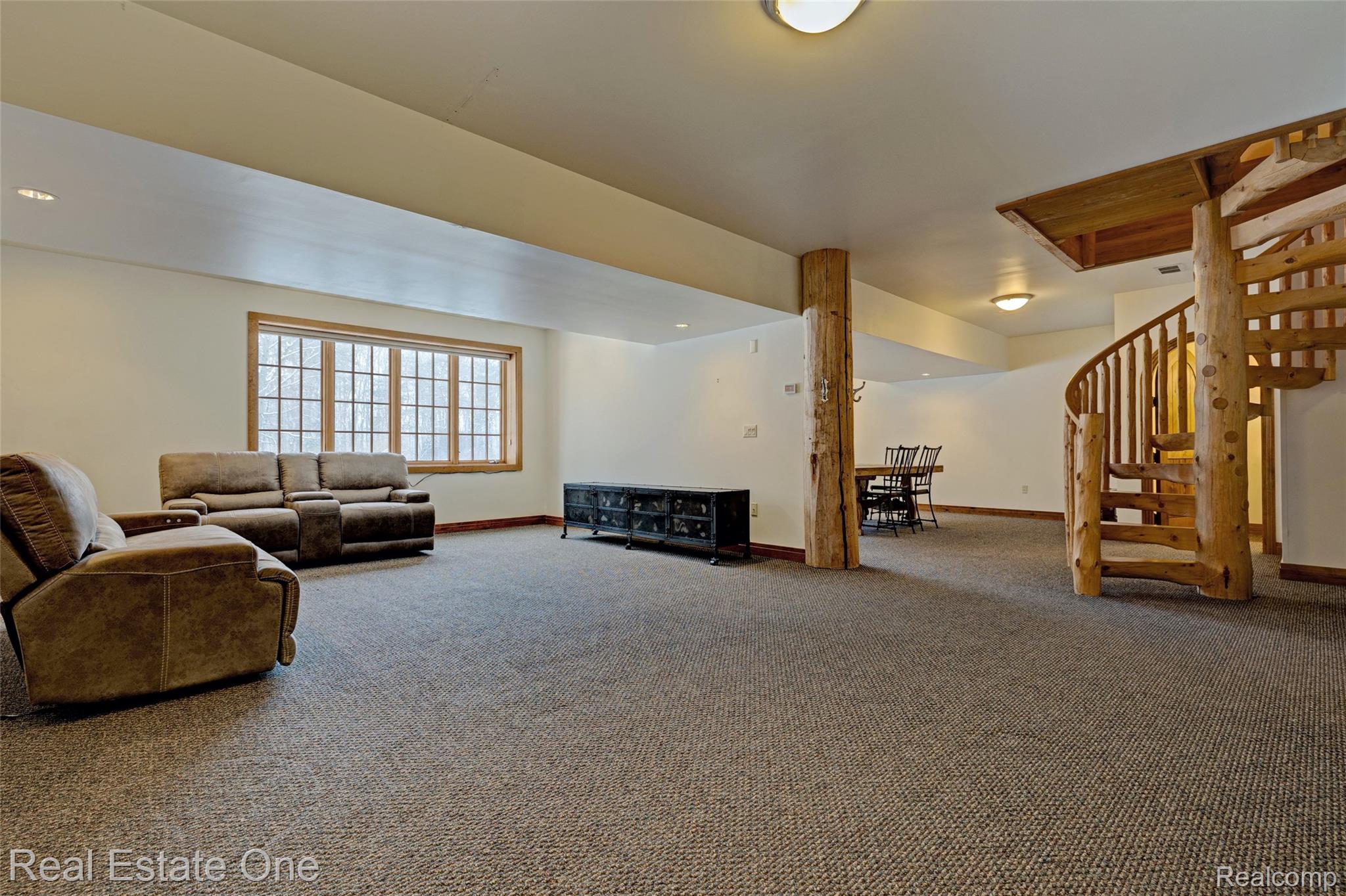 4340 Lahring Road Holly, MI 48442 - Photo 48 of 89 Carpeted living room featuring baseboards and stairway