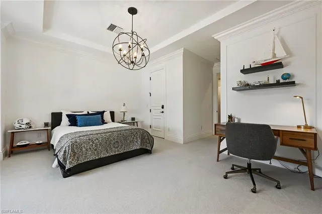 a bedroom with bed and a chair