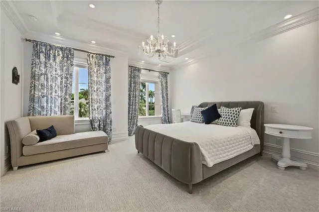 a spacious bedroom with a bed and a couch