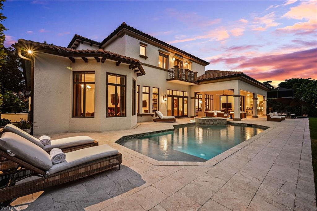 333 Sedgwick Court Naples, FL 34108 - Photo 8 of 49 a view of a house with swimming pool and sitting area