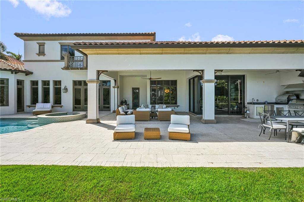 333 Sedgwick Court Naples, FL 34108 - Photo 9 of 49 a view of a house with patio and lake view