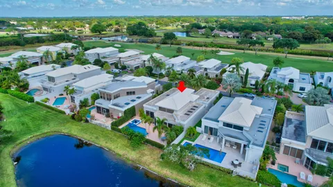 an aerial view of multiple houses with yard