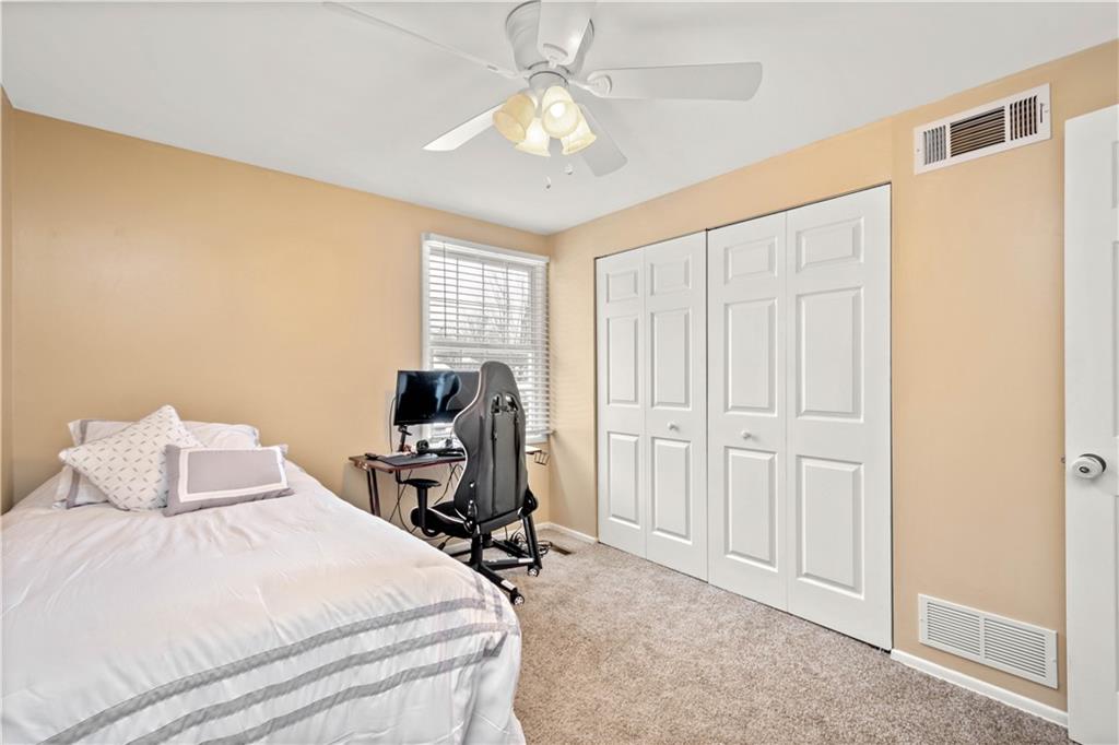2143 Pendleton Drive Monroeville, PA 15146 - Photo 16 of 25 a bedroom with a bed and a chandelier