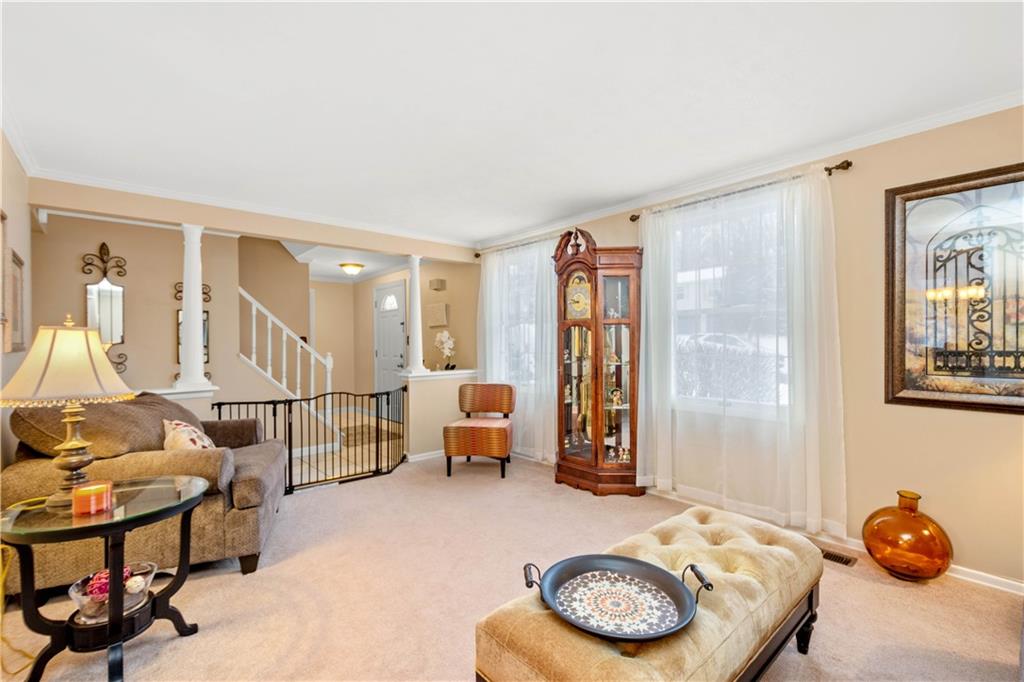 2143 Pendleton Drive Monroeville, PA 15146 - Photo 2 of 25 a bedroom with a bed and a chandelier