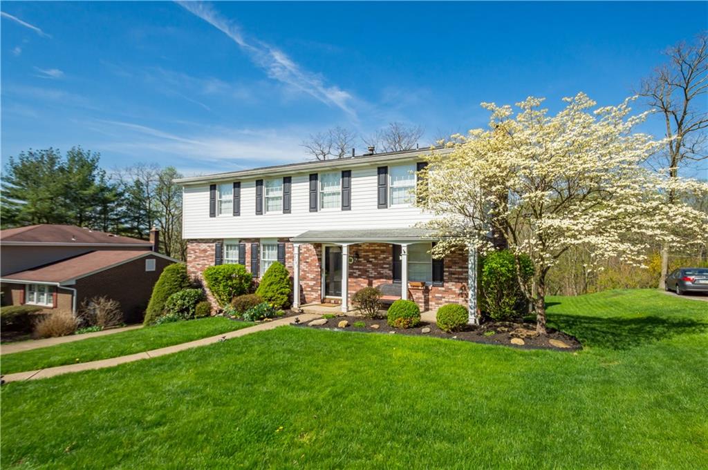 2143 Pendleton Drive Monroeville, PA 15146 - Photo 24 of 25 a front view of a house with a yard table and chairs