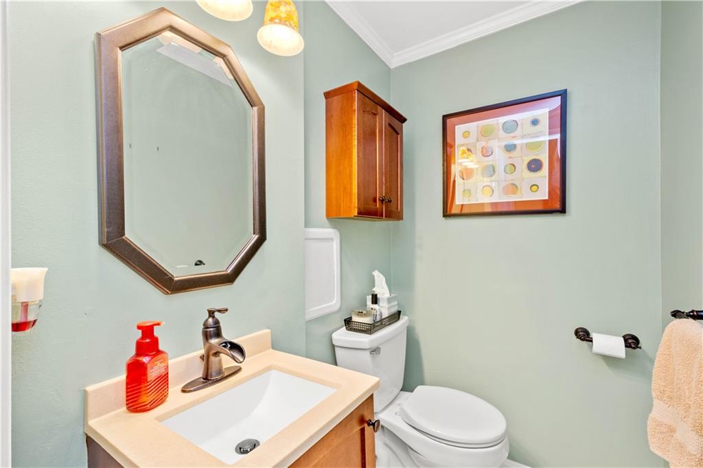 2143 Pendleton Drive Monroeville, PA 15146 - Photo 7 of 25 a bathroom with a toilet a sink and a mirror