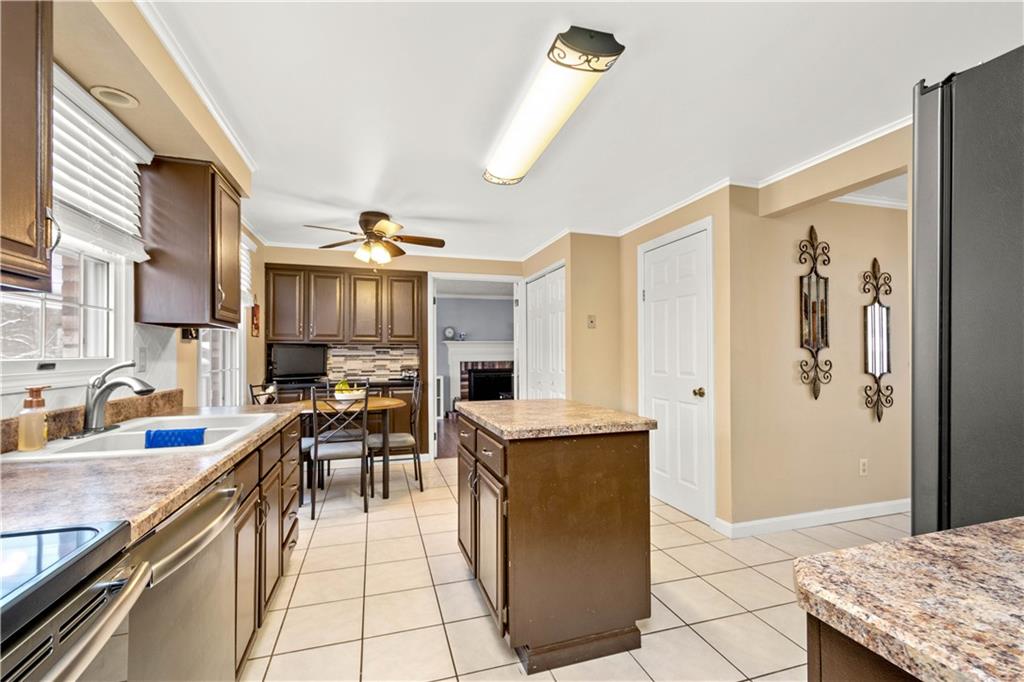 2143 Pendleton Drive Monroeville, PA 15146 - Photo 10 of 25 a kitchen with granite countertop a sink a counter top space appliances and cabinets
