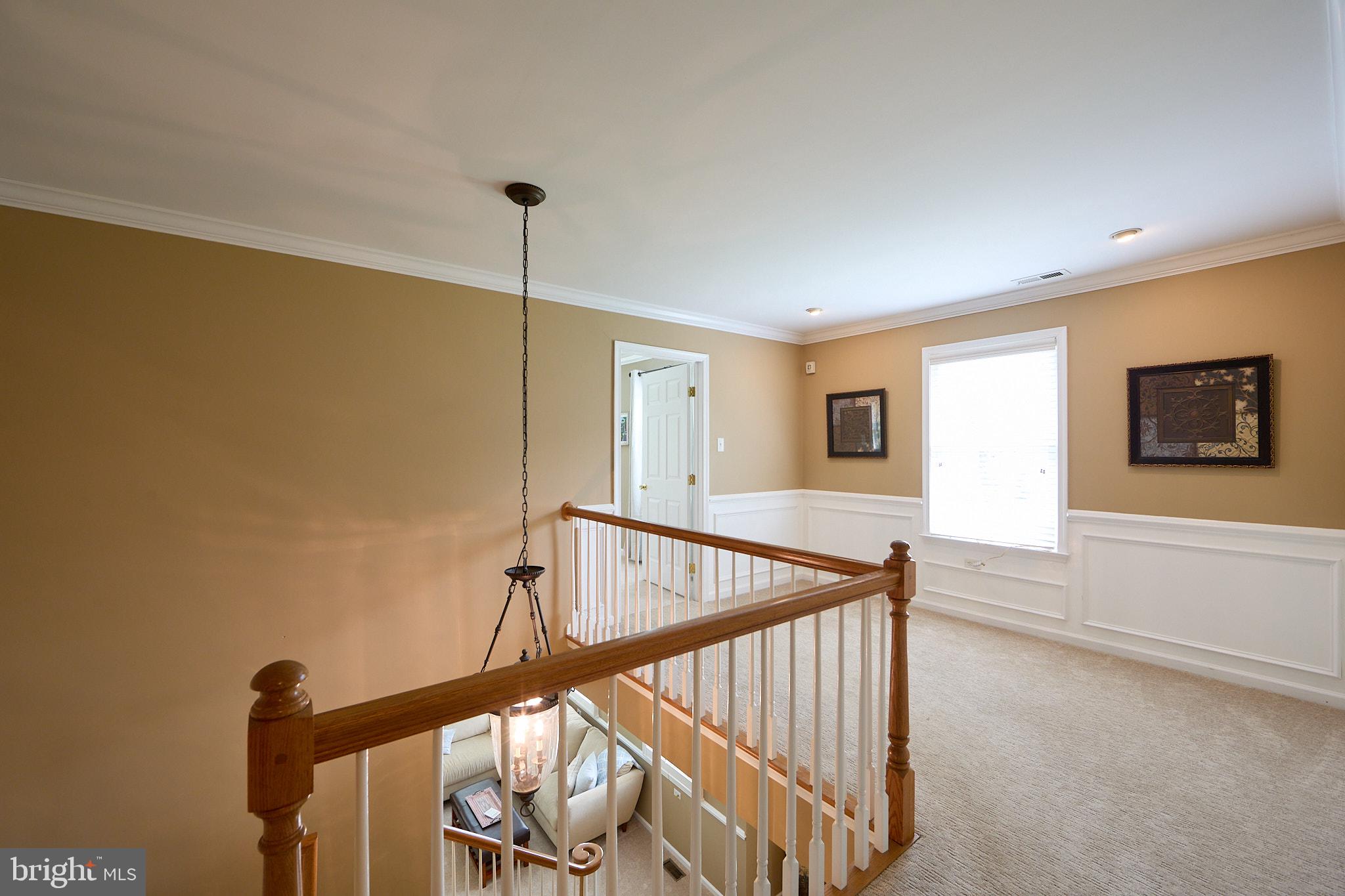 661 St Matthews Road Chester Springs, PA 19425 - Photo 26 of 64 Elegant staircase with warm tones.