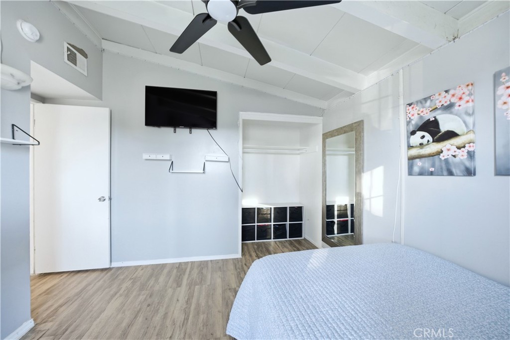 10909 1st Whittier, CA 90603 - Photo 14 of 30 a bedroom with a bed and a flat screen tv