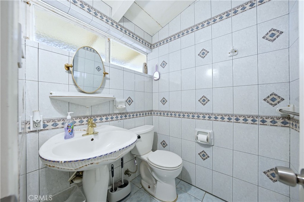 10909 1st Whittier, CA 90603 - Photo 22 of 30 a bathroom with a sink toilet and shower