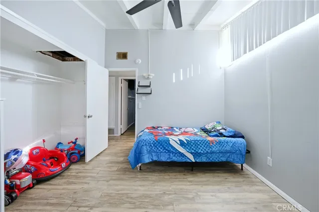 a bedroom with a bed and a couch