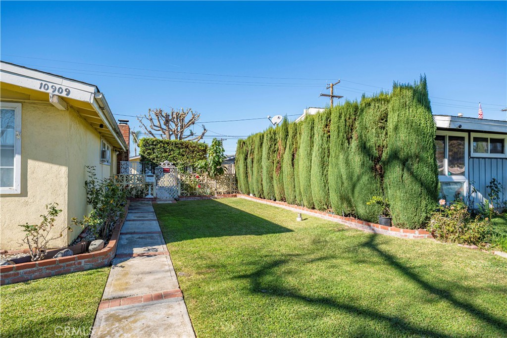 10909 1st Whittier, CA 90603 - Photo 3 of 30 a view of a garden with a building in the background