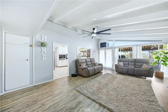 a bedroom with furniture and a potted plant