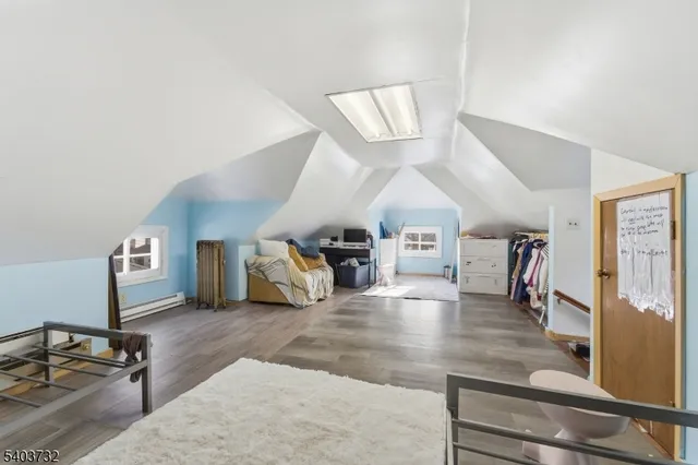 a view of a bedroom with a large bed and a large window