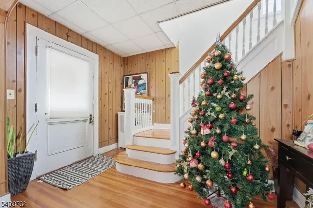 a living room filled with furniture and a potted plant