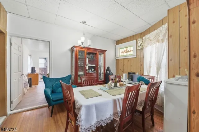 a living room with furniture windows and a flat screen tv