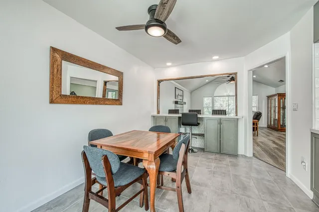 a kitchen with a window and cabinets
