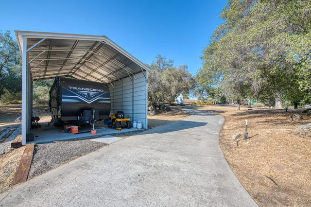 a view of a yard covered with snow in the background