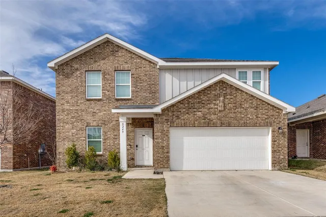 front view of a house with a yard