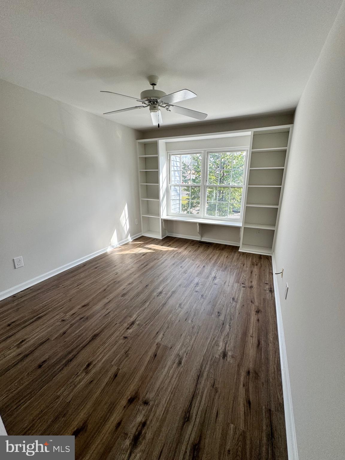 692 Danbury Court Newtown, PA 18940 - Photo 12 of 16 wooden floor in an empty room with a window