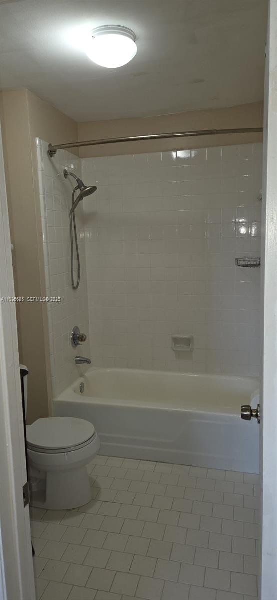 8020 North Colony Circle, Unit 305 Tamarac, FL 33321 - Photo 16 of 19 a bathroom with a shower a toilet and a shower