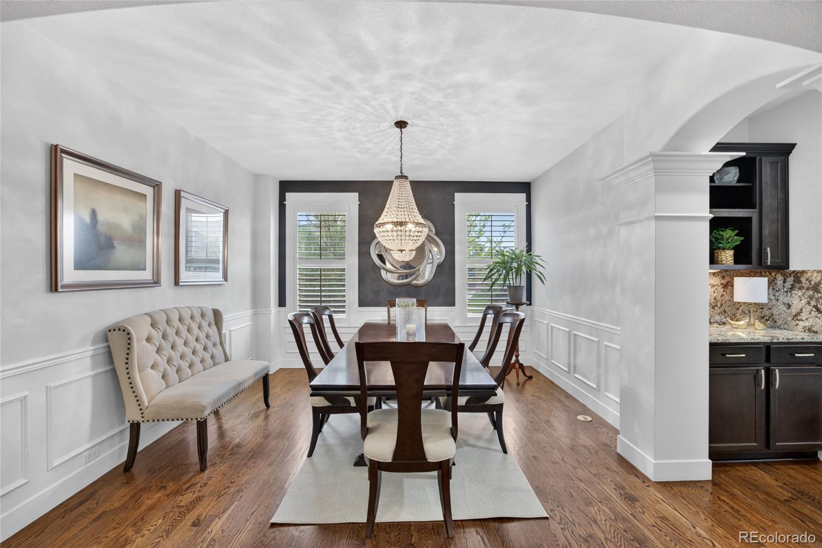 20554 East Shady Ridge Road Parker, CO 80134 - Photo 16 of 49 a view of a dining room with furniture window and wooden floor