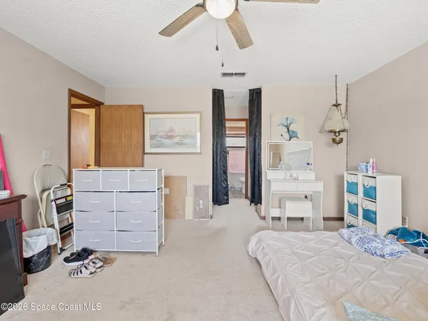 a bedroom with a bed and furniture