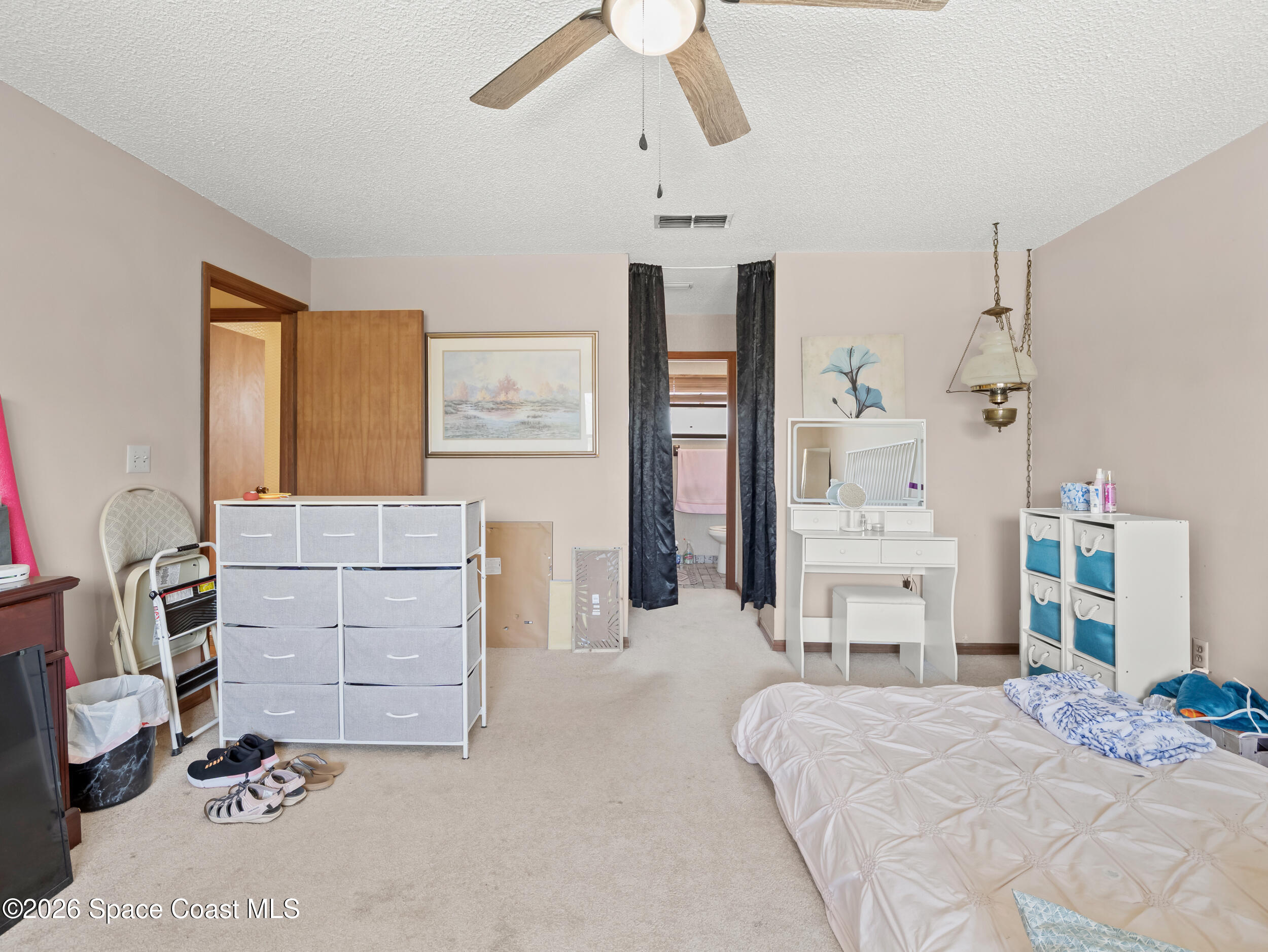 1190 Shady Lane Merritt Island, FL 32952 - Photo 11 of 35 a bedroom with a bed and furniture