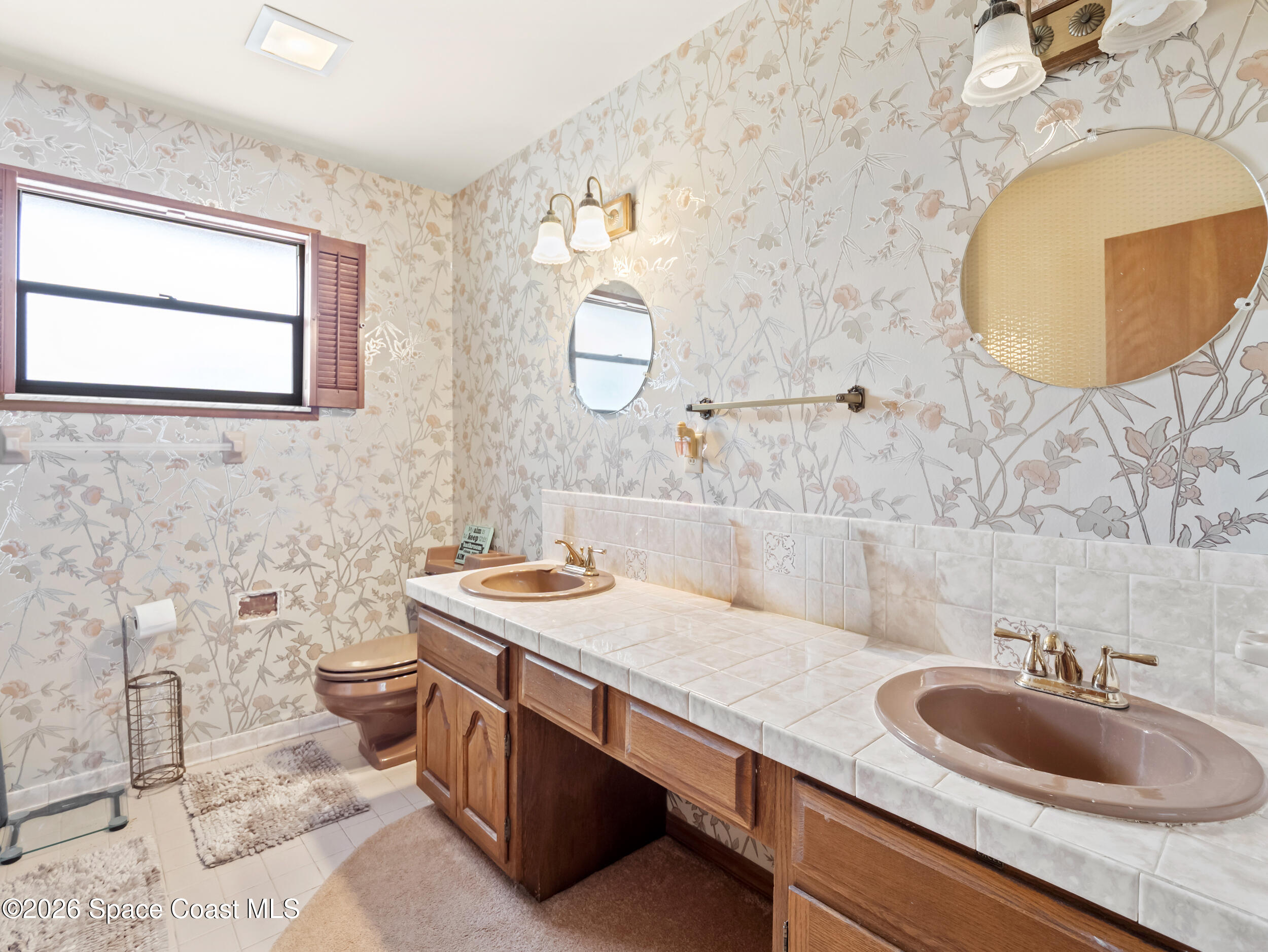 1190 Shady Lane Merritt Island, FL 32952 - Photo 16 of 35 a bathroom with a sink and a mirror