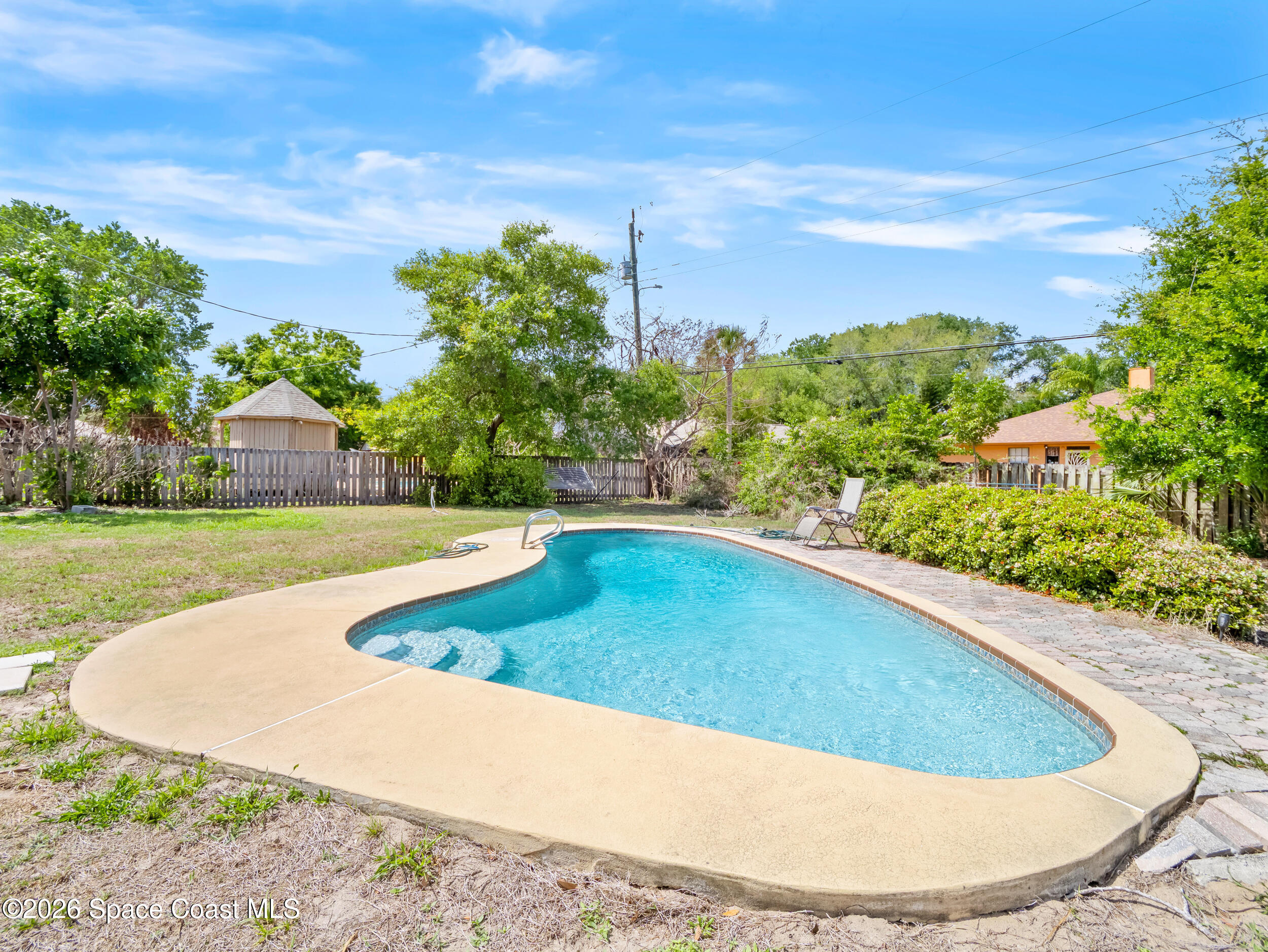 1190 Shady Lane Merritt Island, FL 32952 - Photo 20 of 35 a view of a swimming pool with a yard