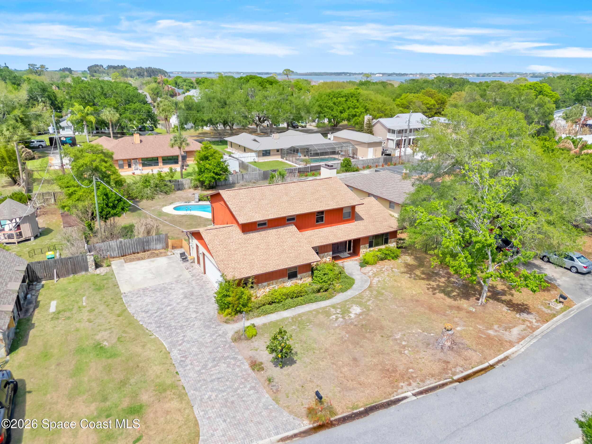 1190 Shady Lane Merritt Island, FL 32952 - Photo 25 of 35 an aerial view of a house with a yard and lake view