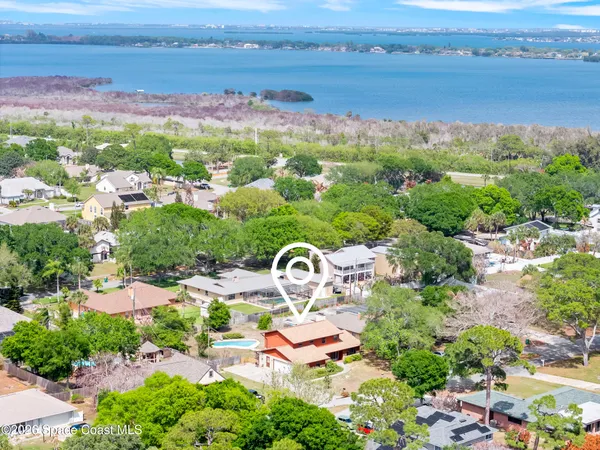an aerial view of a house with garden space and outdoor space