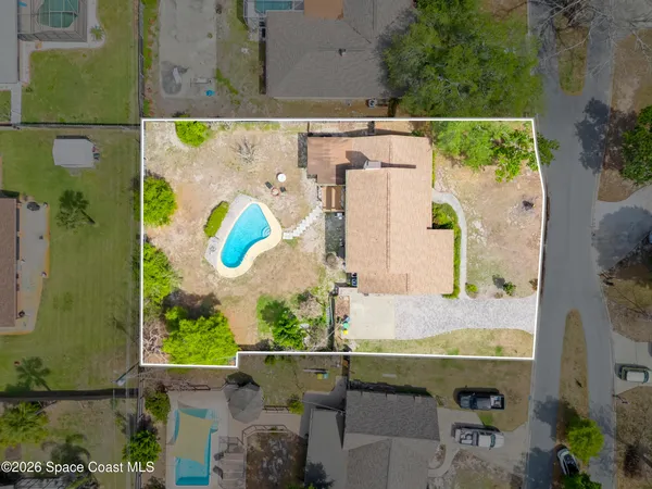 an aerial view of houses with outdoor space
