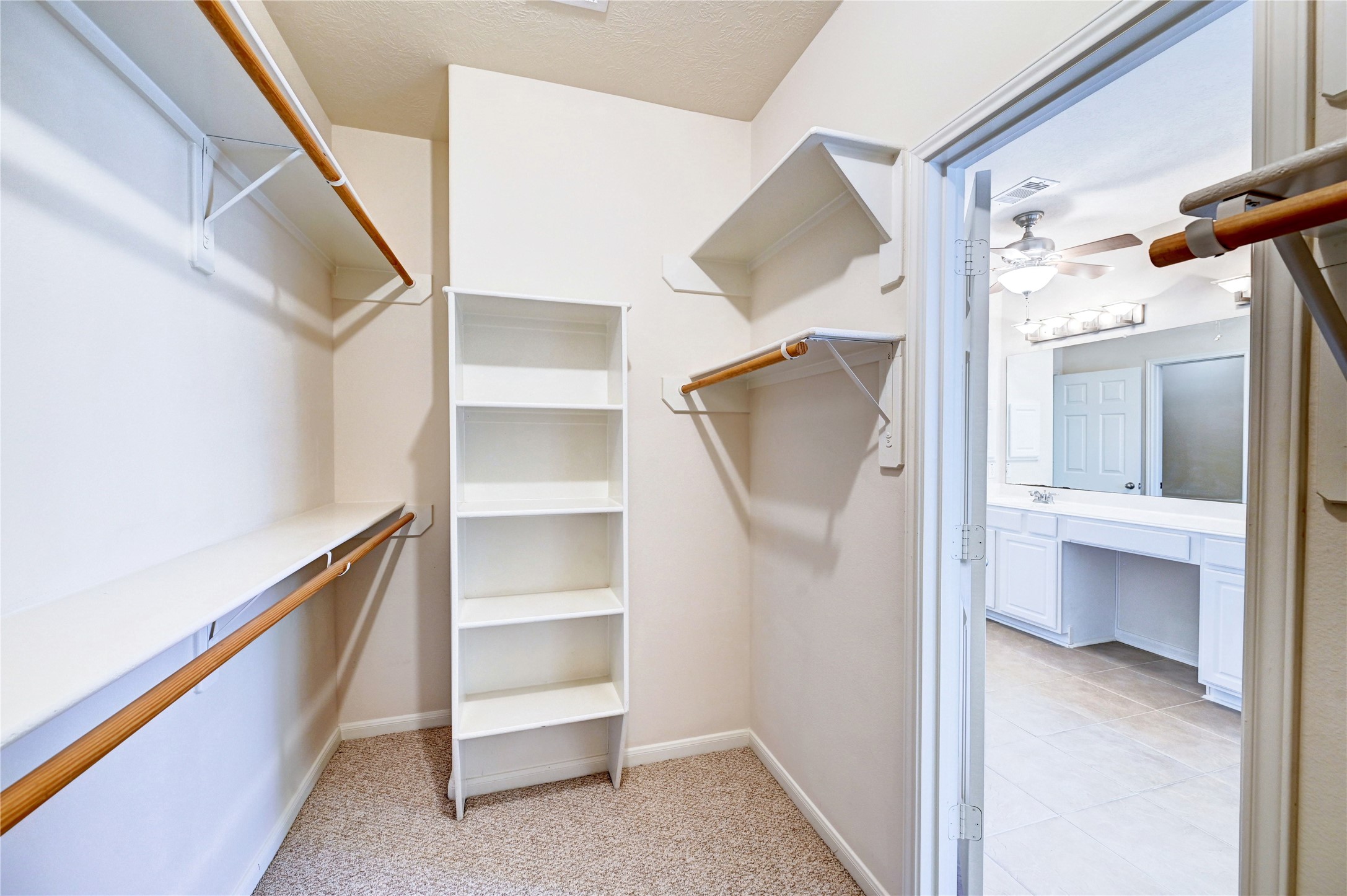 24818 Corbin Gate Drive Spring, TX 77389 - Photo 15 of 49 Some shoe shelves and plenty of hanging in primary closet