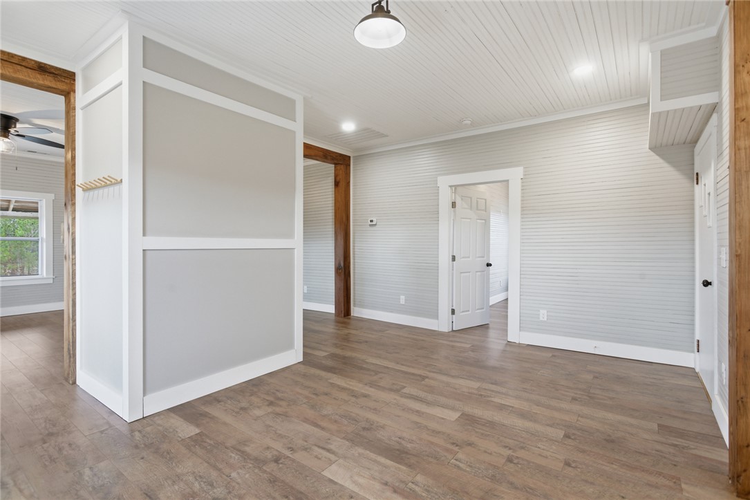 118 Grogan Road Westminster, SC 29693 - Photo 7 of 50 Rich wood-look flooring and clean millwork highlight the transitional space.