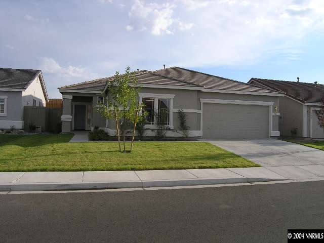 1714 Trek Trail Reno, NV 89521 - Photo 1 of 4 front view of house with a yard