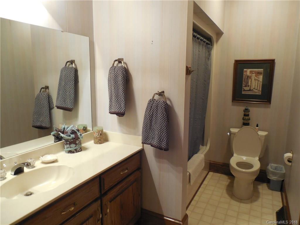 930 Shive Road Salisbury, NC 28146 - Photo 12 of 36 a bathroom with a toilet sink and mirror