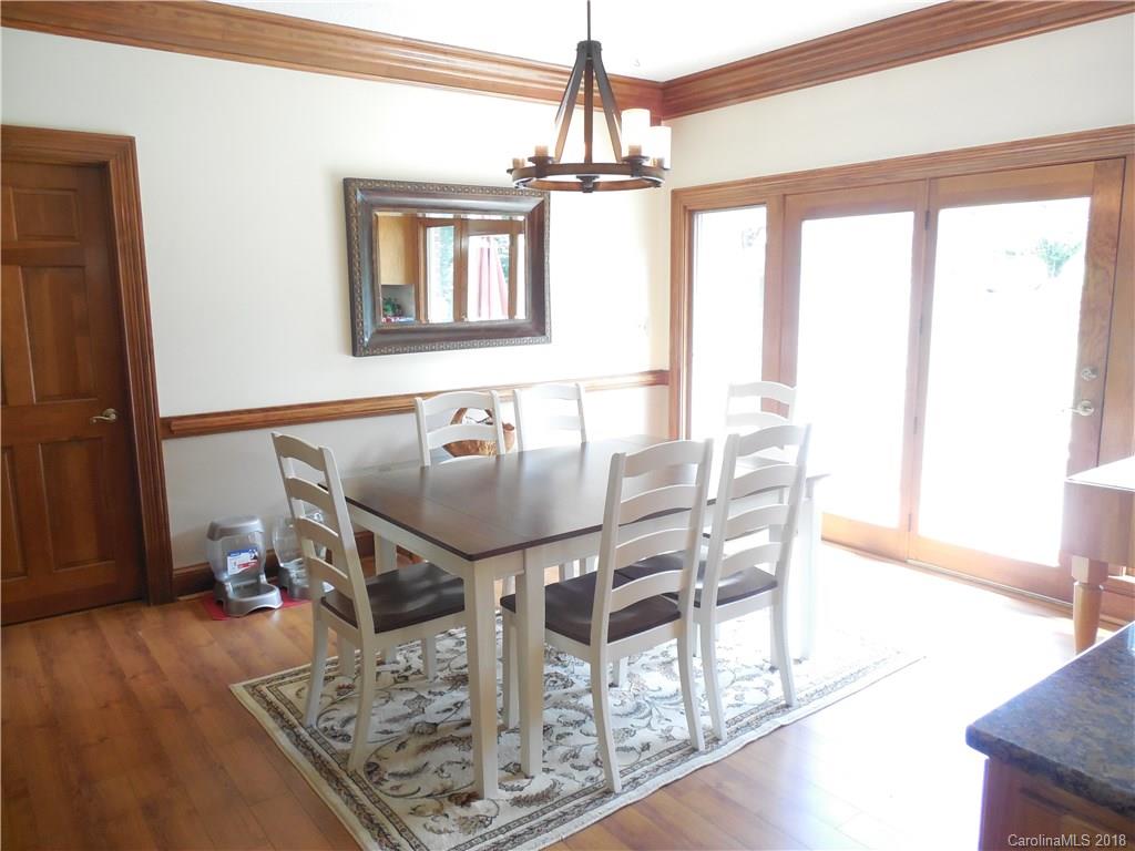 930 Shive Road Salisbury, NC 28146 - Photo 15 of 36 a view of a dining room with furniture window and wooden floor