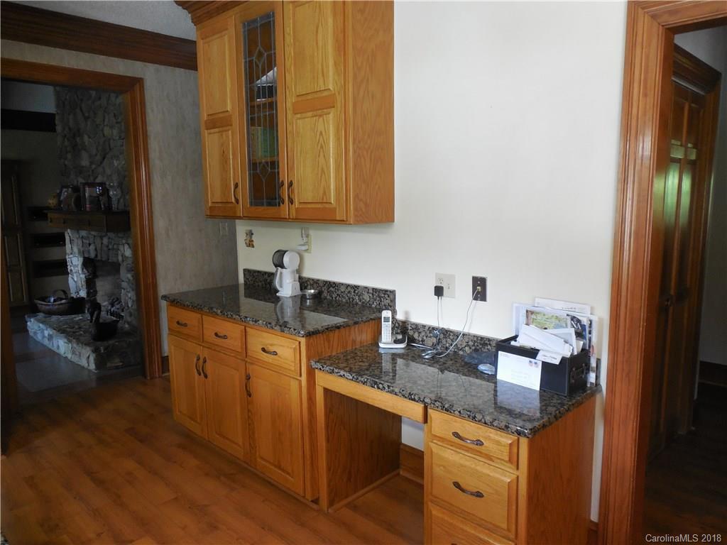 930 Shive Road Salisbury, NC 28146 - Photo 16 of 36 a kitchen with stainless steel appliances granite countertop a sink stove and cabinets